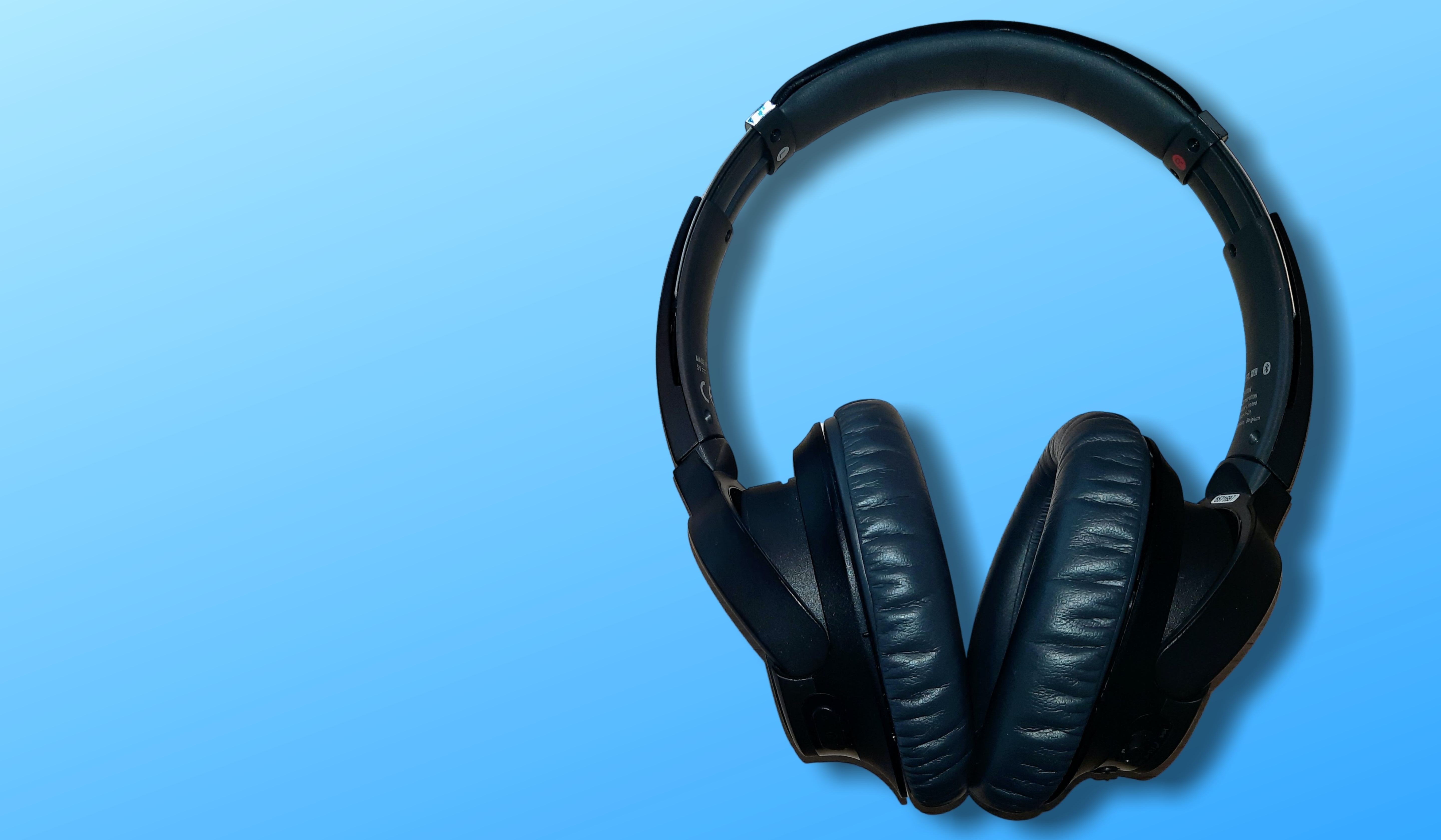 A pair of headphones on a blue background symbolizes the enhancement of audio quality, turning low-quality voice samples into high-resolution sound